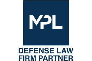 Gavel and Stethoscope on Reflective Wooden Table.